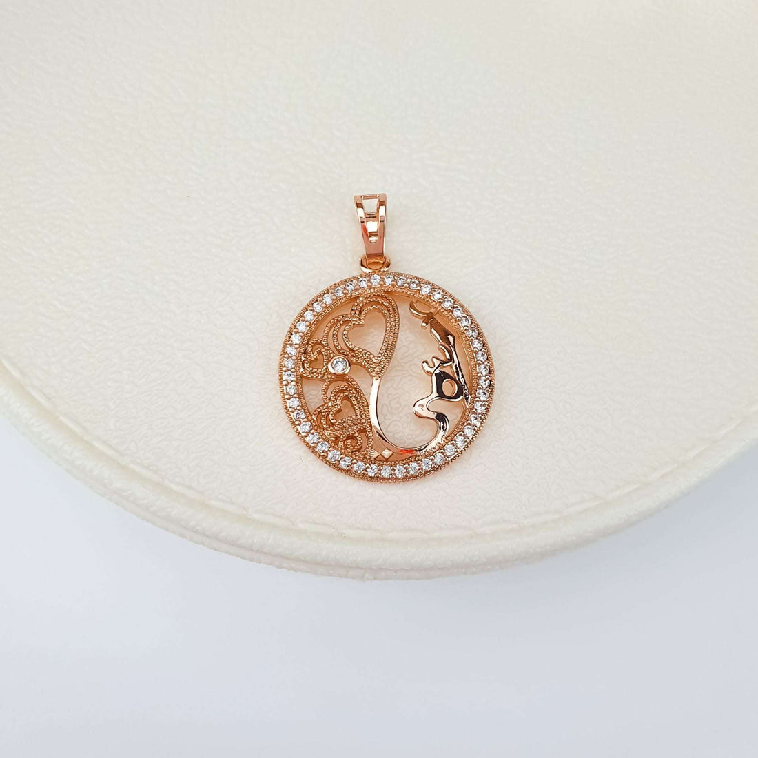 Pendant with a mother's profile and hearts on a cream jewellery box