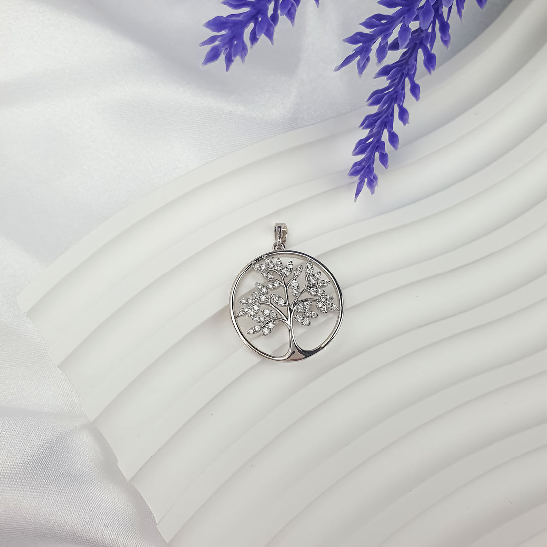 Tree of Life pendant on white drapery with lavender flowers