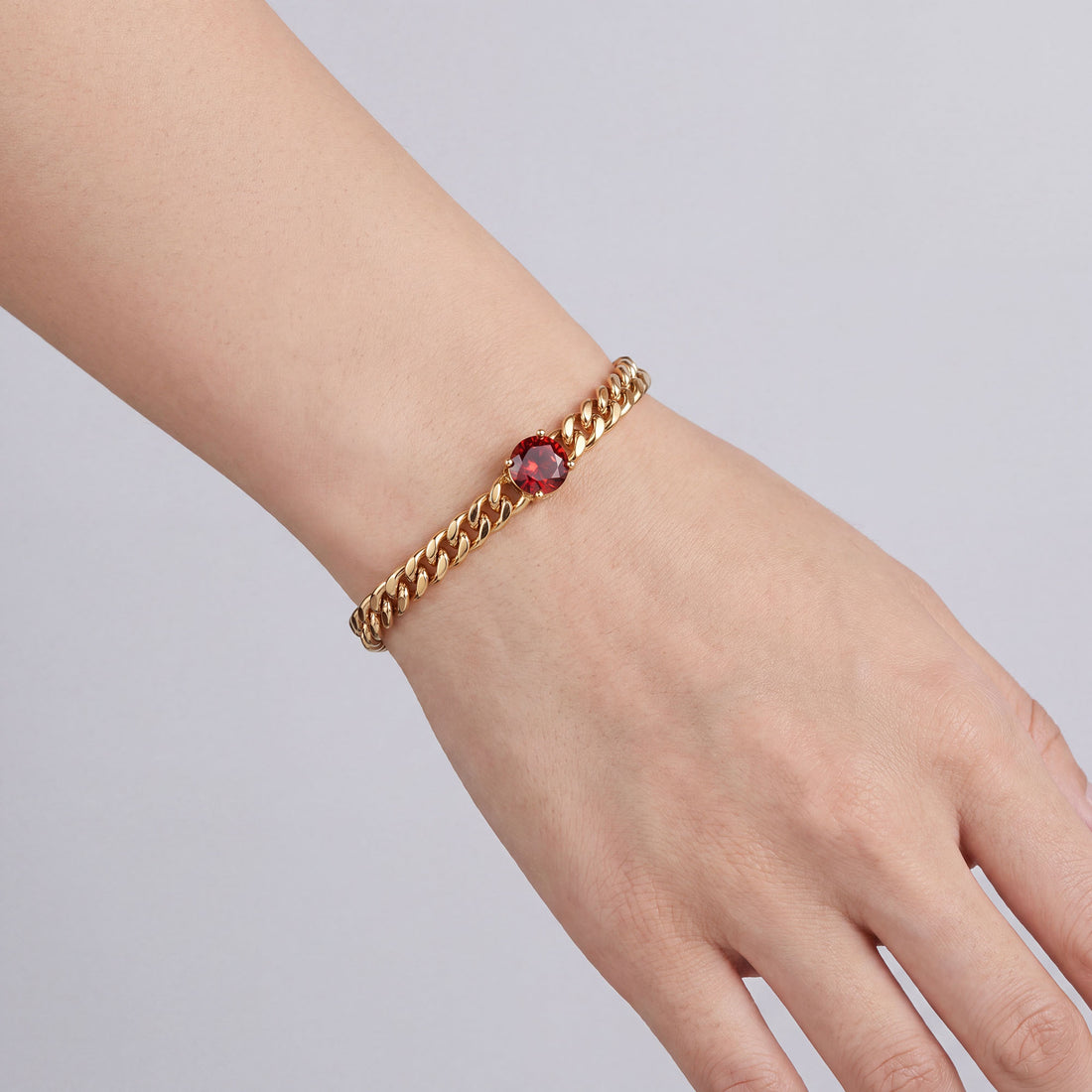 Red | Gold-tone 6 mm curb bracelet with a red cubic zirconia