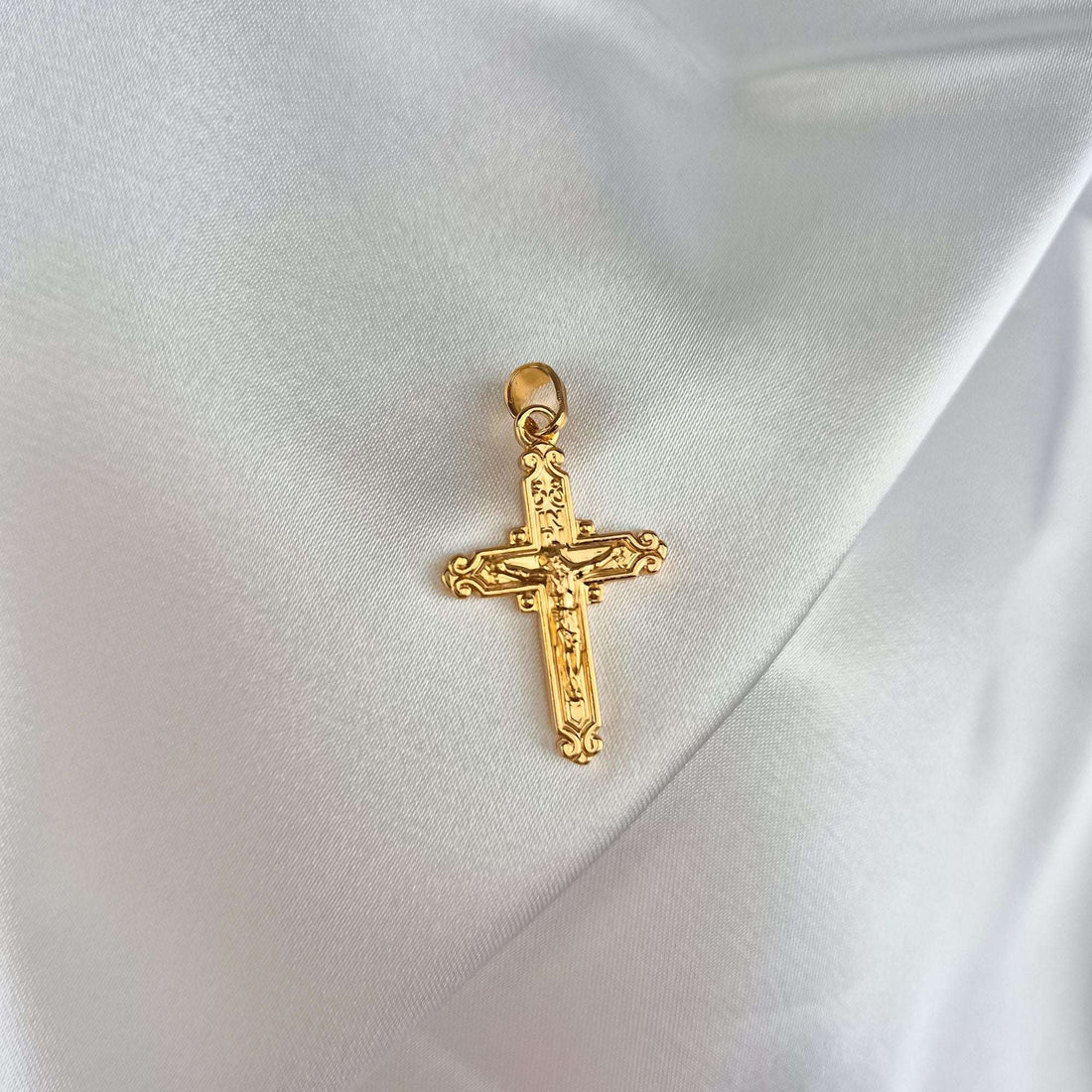 Gold-plated Catholic cross pendant with Christ and INRI on white satin