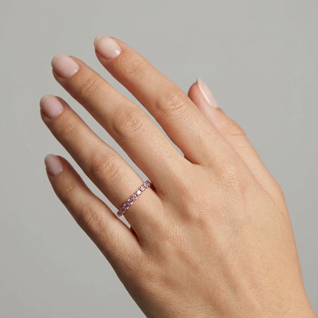 Pink crystal ring worn on a model's finger