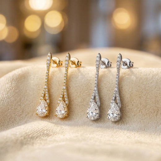 Two pairs of cubic zirconia drop earrings with push-backs, gold-tone and silver-tone