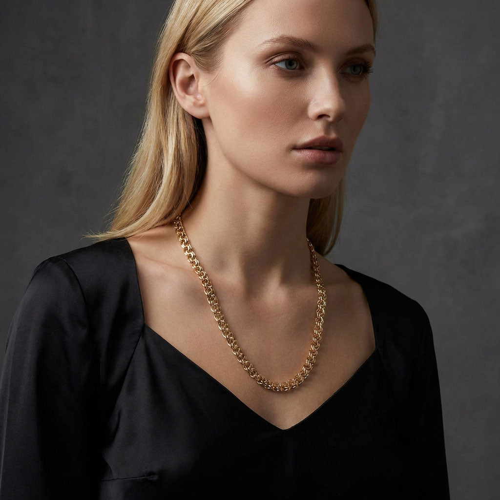 Model in a black blouse wearing the gold-plated Garibaldi chain