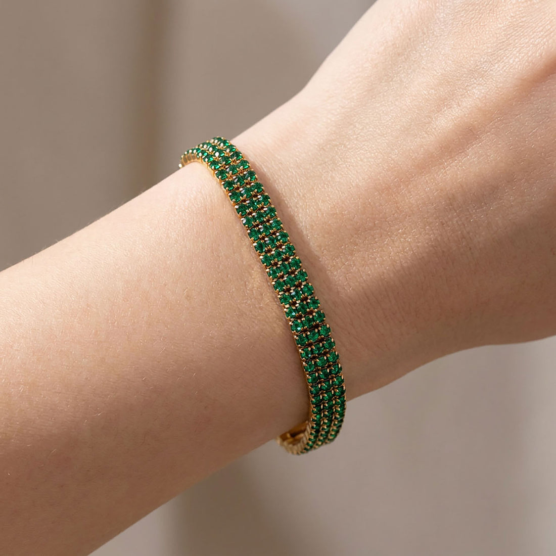 Green stone bracelet styled for an evening out