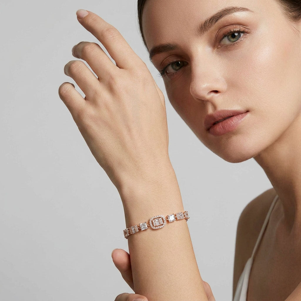 Model wearing a gold-plated cubic zirconia bracelet on her wrist, light studio background