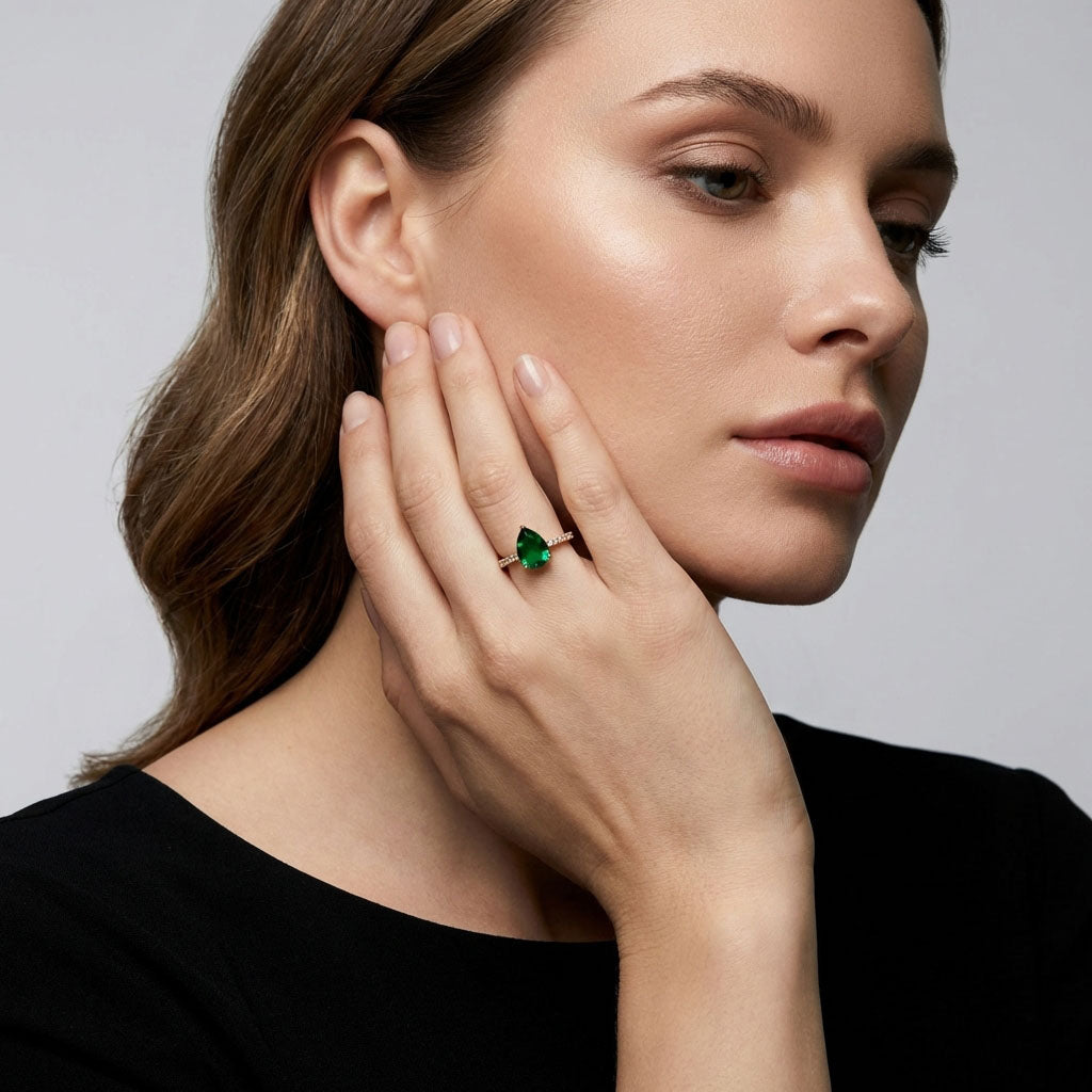 Model showing the gold-plated green teardrop ring on her finger
