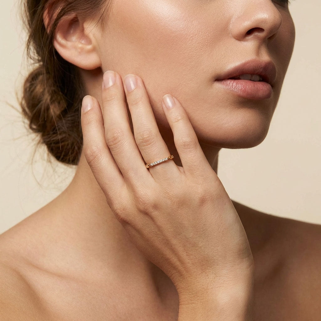 Model wearing the slim gold-plated ring on her middle finger