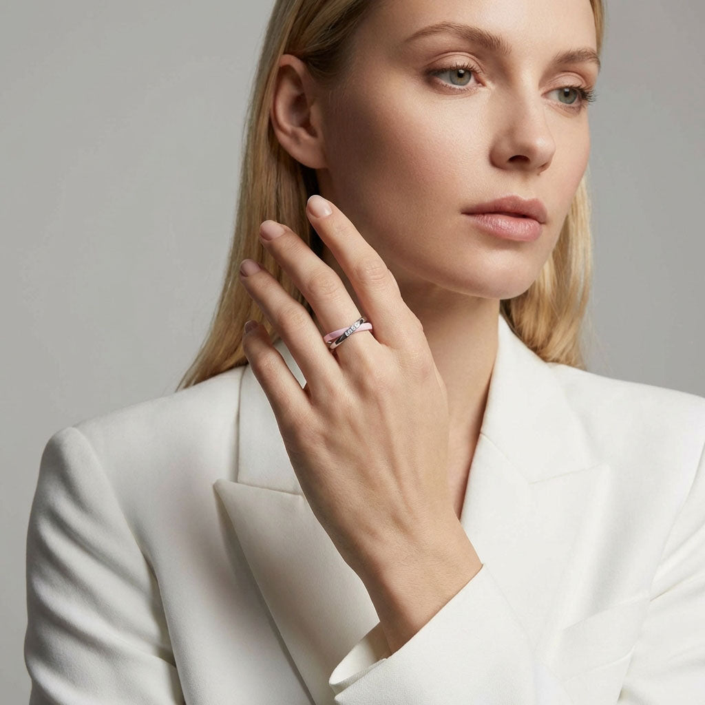 Model in a white jacket wearing the double pink ceramic ring