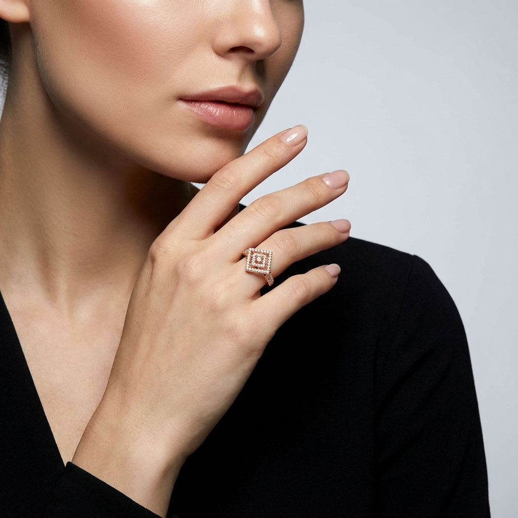 Rhombus cubic zirconia ring on a model's finger by a black blouse