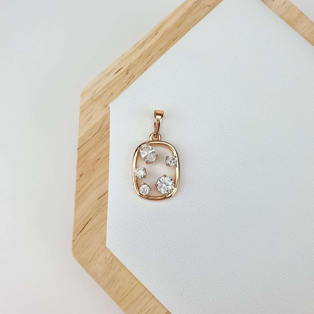 Oval open frame pendant with cubic zirconia placed off-centre