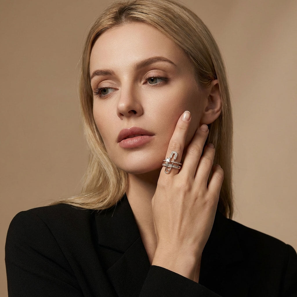 Blonde woman in a black jacket showing the star ring by her face
