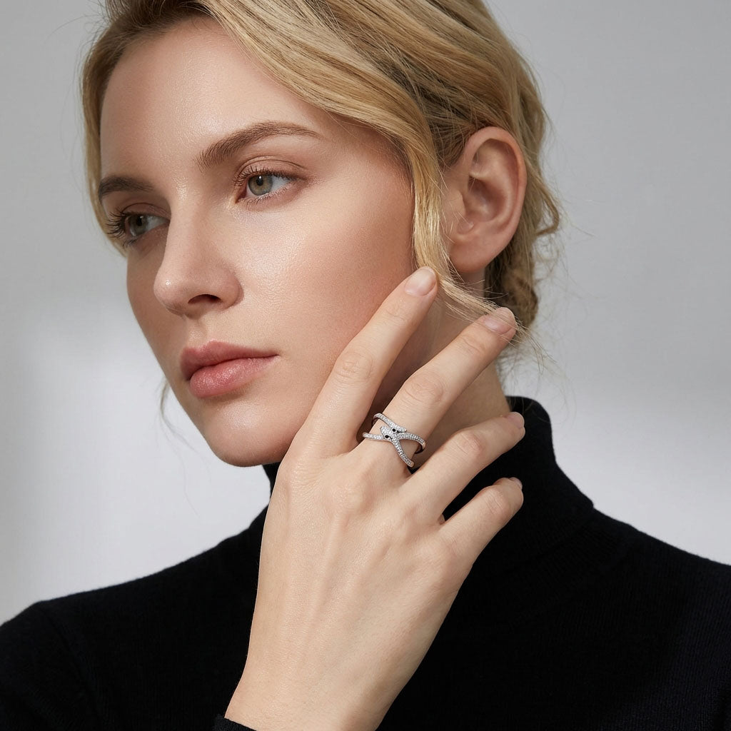 Model in a black polo neck wearing the silver-tone snake ring