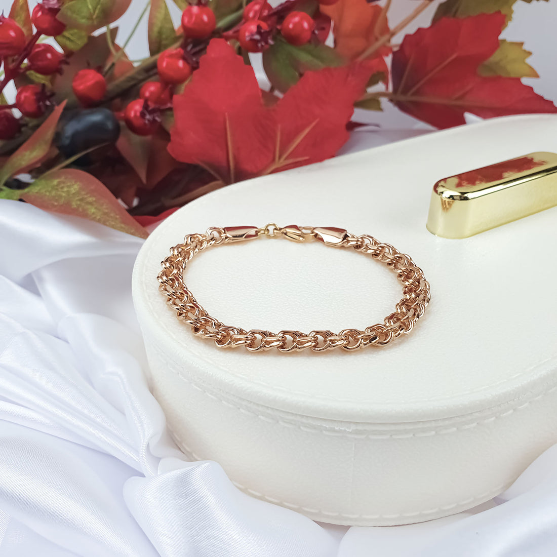 Chunky Bismarck chain bracelet with gold plating on a light jewellery box
