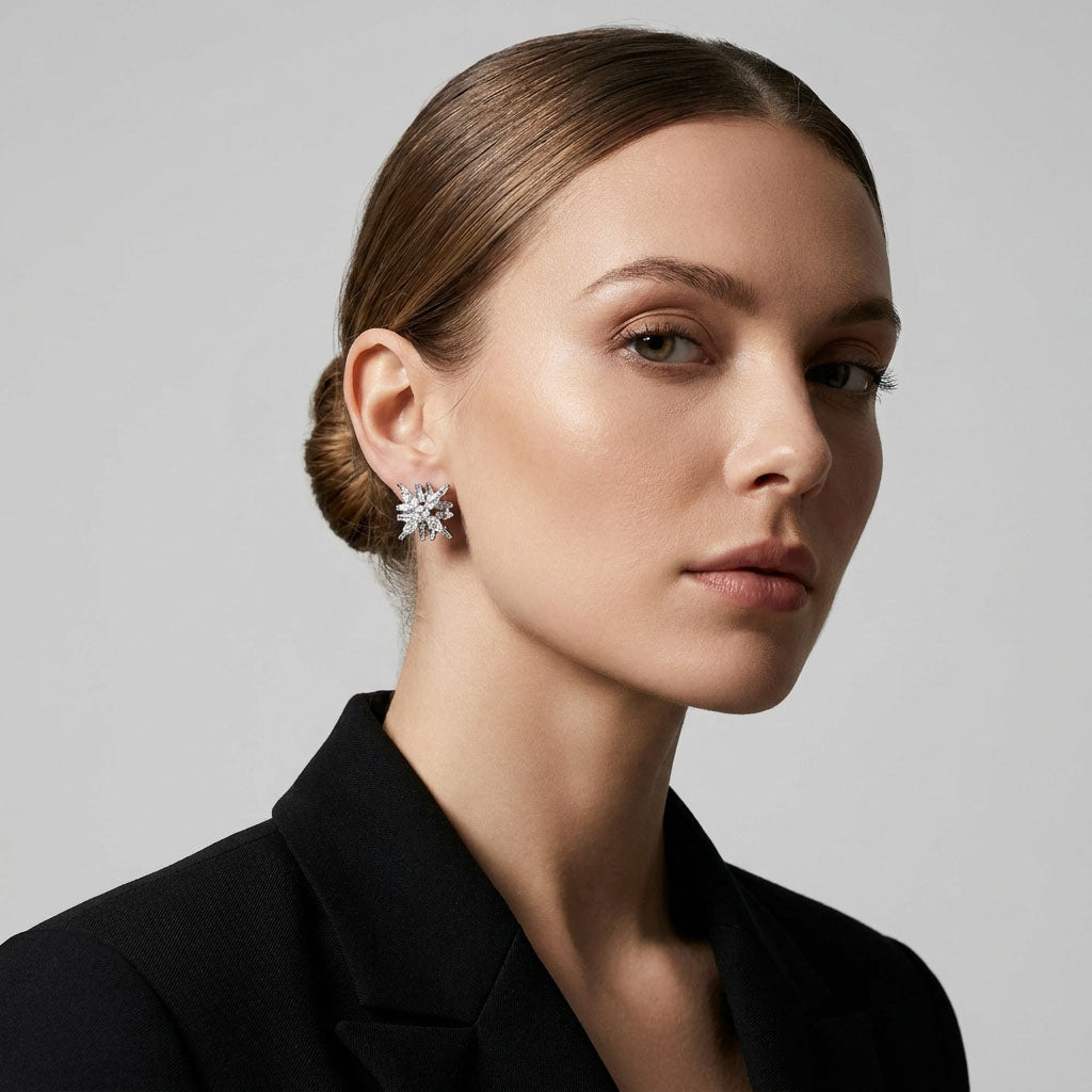 Model in a black blazer wearing a snowflake clip-on earring
