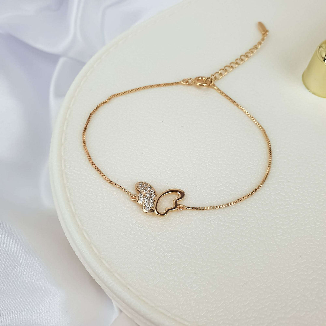 Close-up of the butterfly bracelet with adjustable chain on a light box