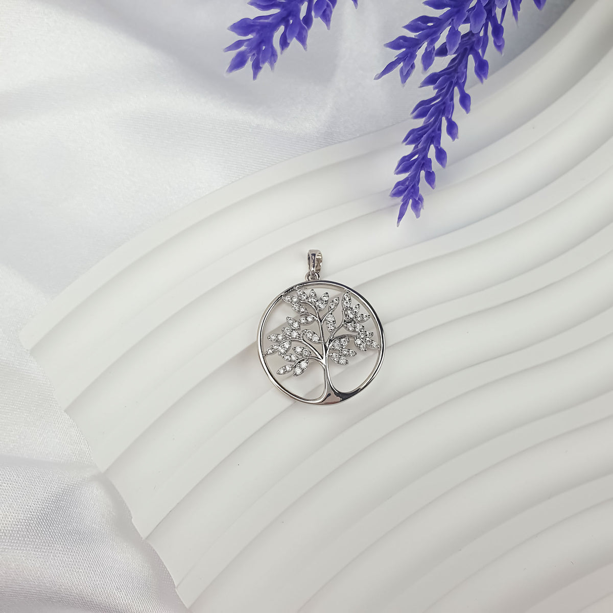 Tree of Life pendant on white drapery with lavender flowers