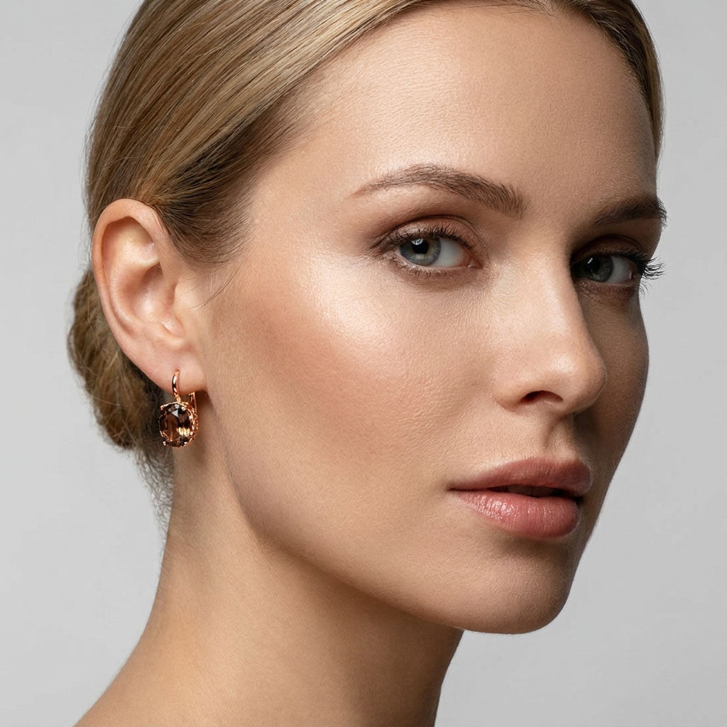 Model in profile wearing a coffee-coloured stone earring with a leverback