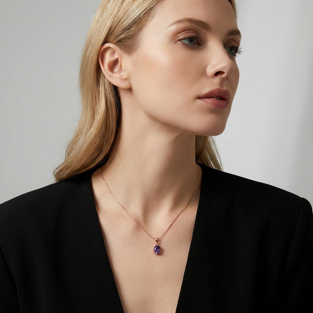 Model in a black jacket wearing violet pendant on a rose gold-tone chain