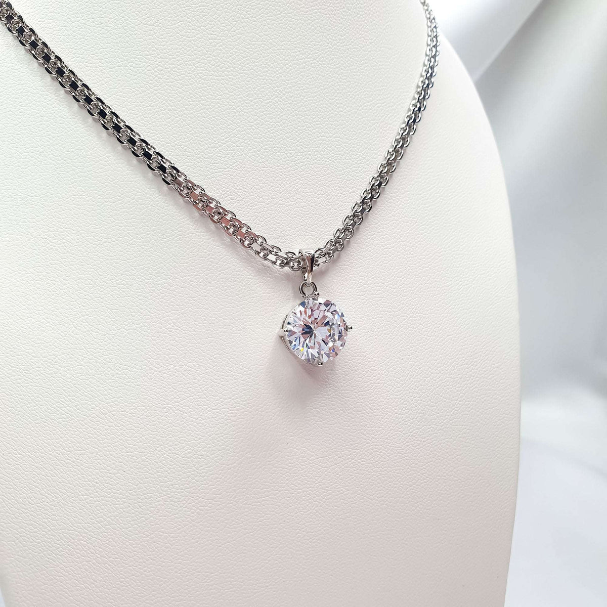 Cubic zirconia pendant on a fine chain, silver-tone plating and sparkling facets