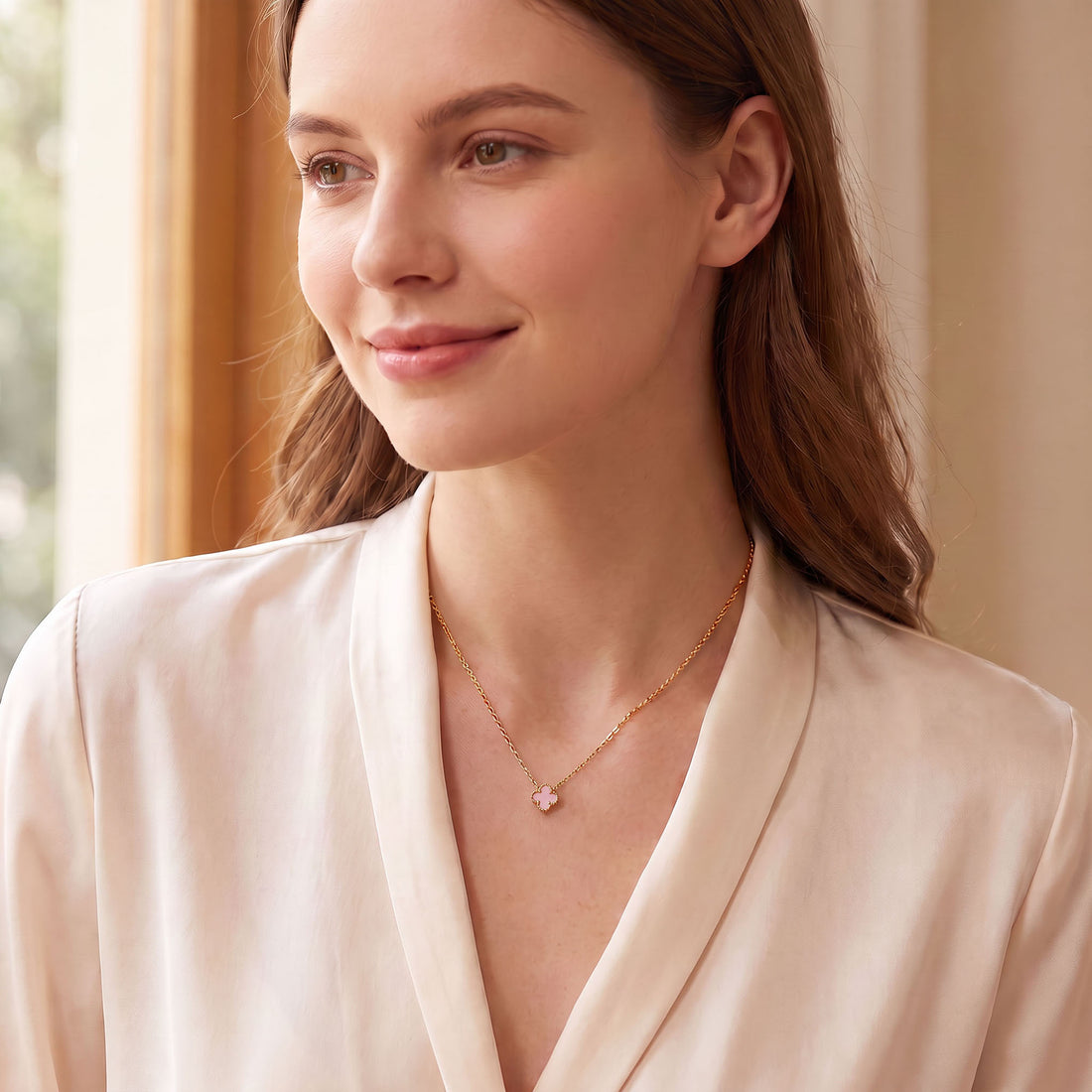 Yellow gold-tone necklace with a clover pendant