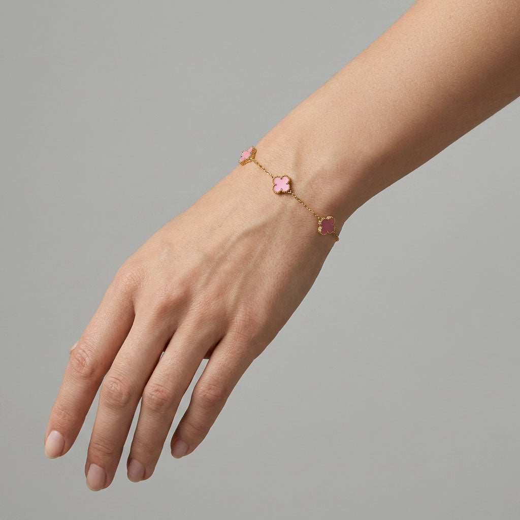 Pale pink clover bracelet on a woman's wrist