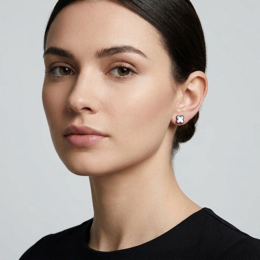 White clover stud with a silver-tone beaded rim in a woman's ear