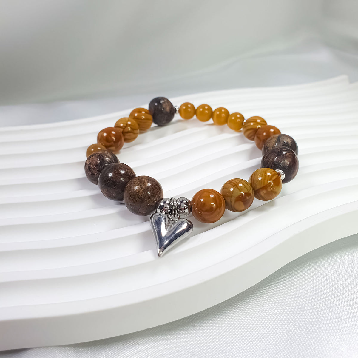 Brown and amber natural stone bracelet with a shiny silver-tone heart charm