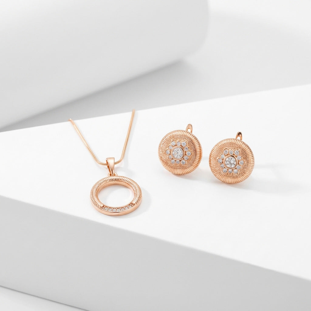 Gold-plated ring pendant and ribbed earrings with white cubic zirconia on a white stand