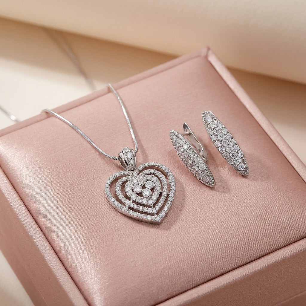 Heart pendant and earrings with white cubic zirconia in a pink gift box