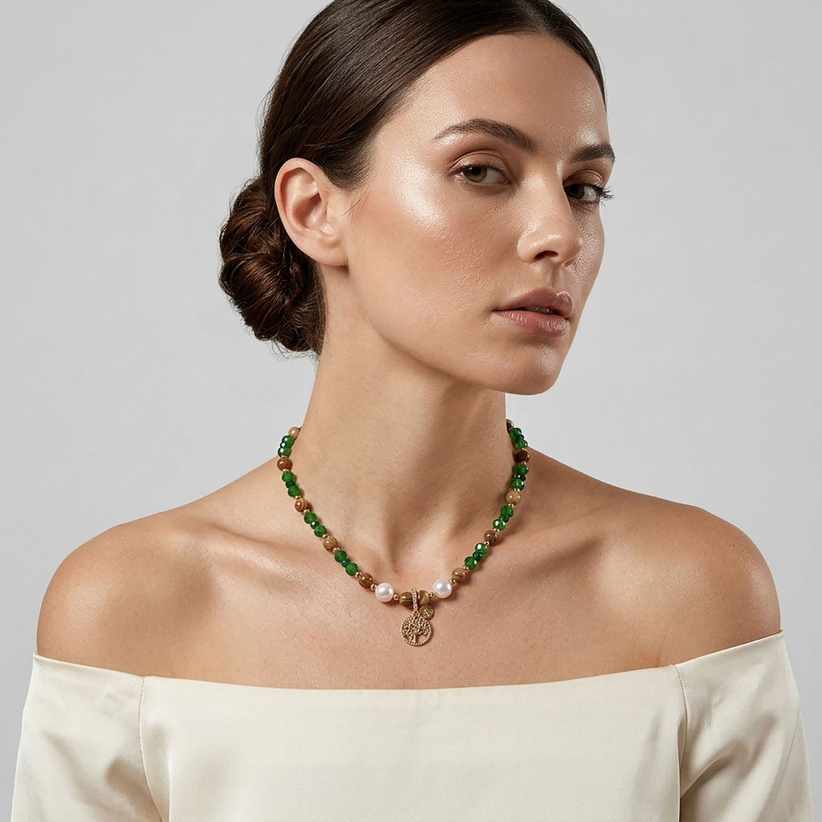 Women's necklace of brown and green stones with pearls