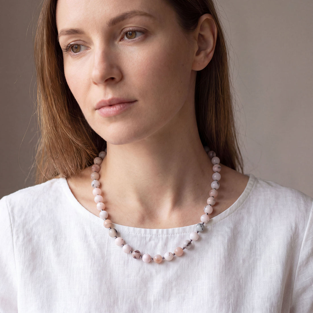 Soft pink synthetic opal bead necklace with silver-tone spacers