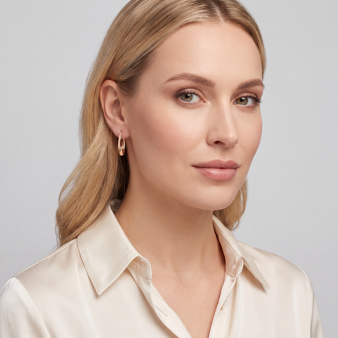 Long gold-plated earrings with a smooth surface