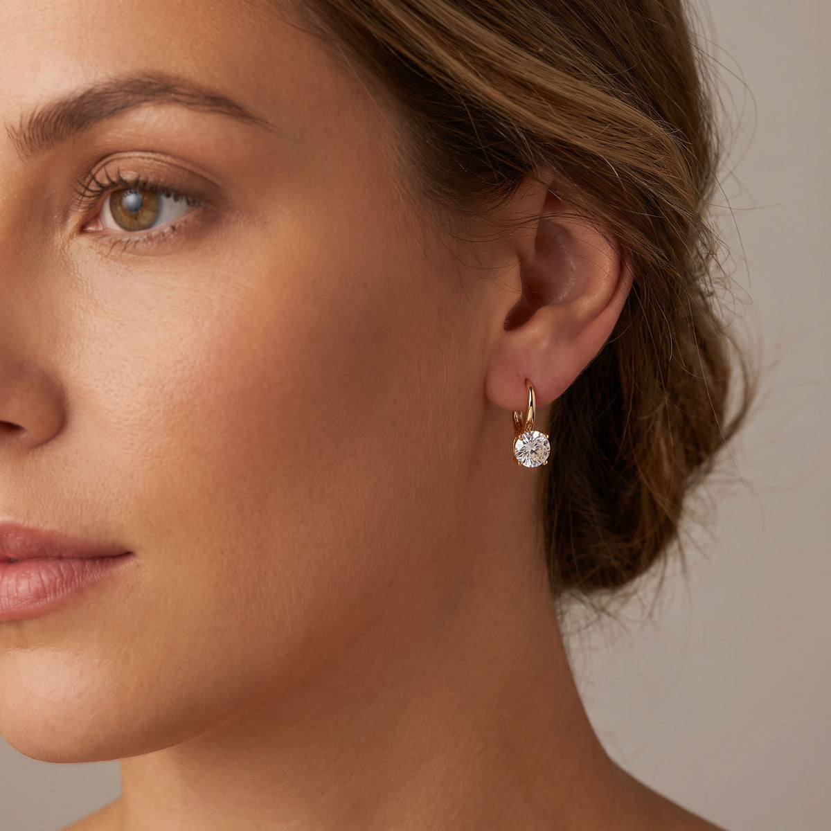 Small everyday earrings with a round stone