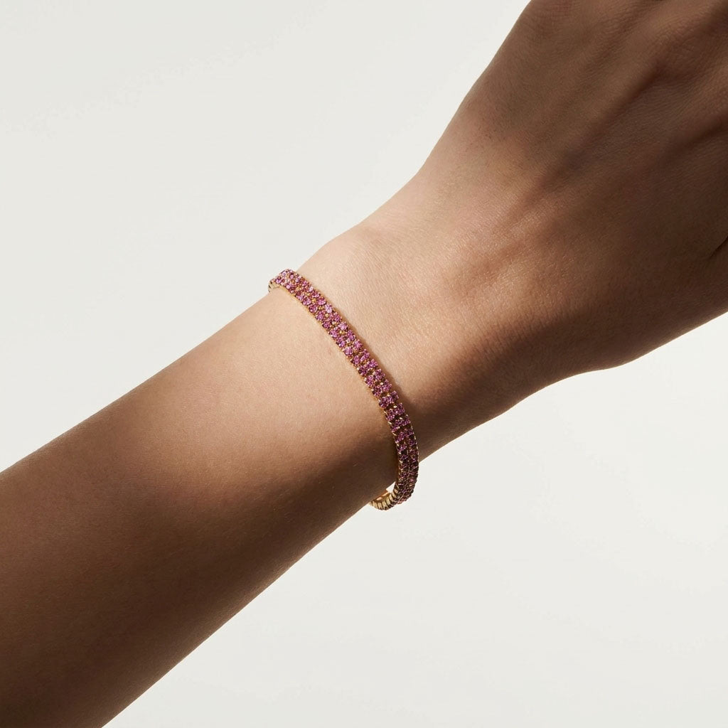 Pink crystal bracelet on a woman's wrist, a delicate everyday piece