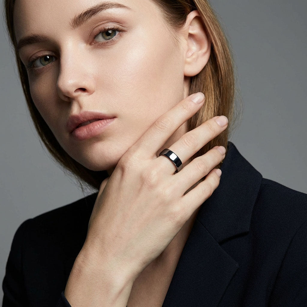 Woman in a black jacket wearing a wide dark grey hematite ring