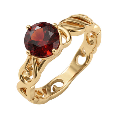 Openwork leaf ring with a red stone