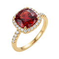Gold-plated ring with a large red stone in a halo of white cubic zirconia