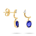 Gold-plated earrings with a dark blue oval stone and a small white teardrop