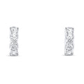 Small silver-tone hoop earrings with a row of clear cubic zirconia on white