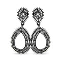 Long black openwork teardrop earrings with small black stones on a white background