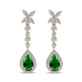 Long gold-plated earrings with a green teardrop stone in a sparkling crystal frame