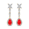 Long gold-plated earrings with a crystal chain and a framed red teardrop stone