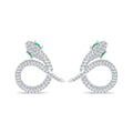 Snake earrings covered in clear cubic zirconia, with green eyes
