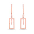 Rectangular drop earrings in rose gold tone with a twisted bar, white background