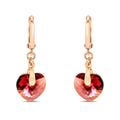 Earrings with heart-shaped crystals in a reddish-pink tone and gold-plated French hooks