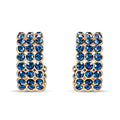 Gold-plated earrings with three rows of deep blue crystals, curved half-hoop shape