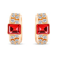 Gold-plated earrings with a rectangular red stone and two rows of cubic zirconia