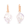 Rose gold-tone earrings with large irregular faux pearls and leverback clasps
