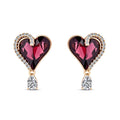 Heart earrings with a dark violet crystal and clear teardrop in gold-tone settings