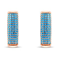 Wide band earrings with five rows of bright blue stones in a gold-tone frame